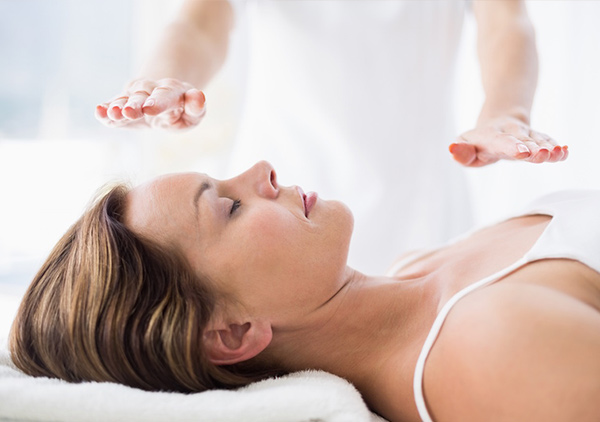 Woman Doing Reiki — Massage Therapist in Macquarie, NSW